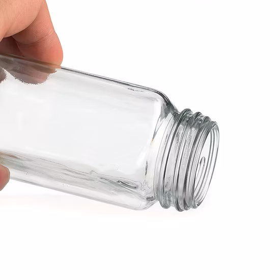Pratica bottiglia in vetro da 100 ml per spezie con coperchio in bambù per condimenti